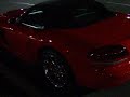 red dodge viper parked at shoprite parking lot