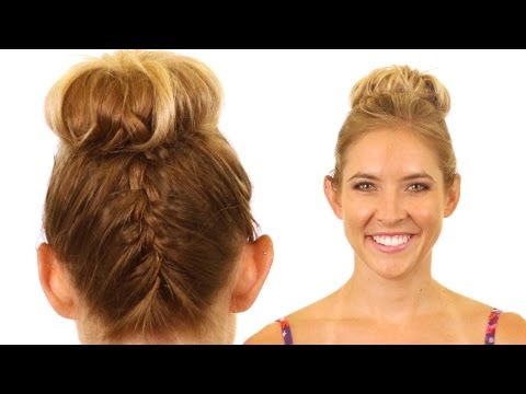 upside down french braid - http://www.rolfssalon.com - Top knots are still one of the top hair trends for 2012. We've added a bit of flair to the normal top knot by combining an upside...