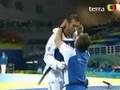 Greek Taekwondoist kisses his coach after fight