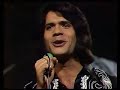 costa cordalis - carolina, komm 1973 

na na na na na na na ...

deine sehnsucht nach dem blauen meer
trieb dich zu mir vom norden her.
du warst fremd in meinem sch�nen land
da nahm ich dich an deiner hand.
deine h�nde waren wie eis
meine sonne brannte so hei�;

oh carolina komm
carolina komm komm
carolina komm mit nach theben
immer nur mit dir
immer will ich mit dir dort leben.

carolina komm
carolina komm komm
carolina komm, geh' nie wieder.
denn gehst du nach haus
geht die sonne f�r immer aus!

oh carolina komm
carolina komm komm
carolina komm mit nach theben
immer nur mit dir
immer will ich mit dir dort leben.
carolina
komm

carolina komm
carolina komm komm
carolina komm, geh' nie wieder.
denn gehst du nach haus
geht die sonne f�r immer aus!

na na na na na na na ...

dann kam eine blaue sommernacht
die g�tter selbst sind aufgewacht.
helena blieb ganz verlassen steh'n
denn paris fand nur dich so sch�n.
carolina, das ist die nacht
deine liebe ist heut' erwacht.

oh carolina komm
carolina komm komm
carolina komm mit nach theben
immer nur mit dir
immer will ich mit dir dort leben.

carolina komm
carolina komm komm
carolina komm, geh' nie wieder.
denn gehst du nach haus
geht die sonne f�r immer aus!

oh carolina komm
carolina komm komm
carolina komm mit nach theben
immer nur mit dir
immer will ich mit dir dort leben.

carolina komm
carolina komm komm
carolina komm, geh' nie wieder.
denn gehst du nach haus
carolina komm komm
carolina komm
carolina komm komm
denn gehst du nach haus
geht die sonne f�r immer aus! hey!