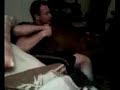 Two guys wrestling in an apartment.