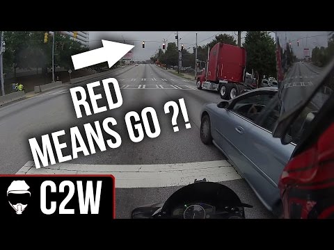 Motorcyclist almost gets hit by driver on CELL PHONE!