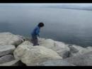 Lucas and Monica climbing rocks at Saint Tropez