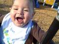 Charlie laughs on swing 1
