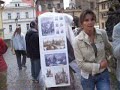 madhavi and jeremy continue to cross the charles bridge in prague in the rain