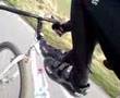 Feet on top tube of fixie (Panda)