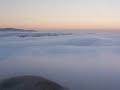Sunset into fog over Pacific & foggy Golden Gate
