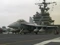 The Navy F-18 in Flight with Navy SH-60 helicopters