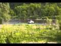 Guy drives his jeep into the Grand River
