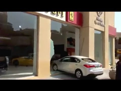 Drunk driver crashes into Ferrari Showroom and escapes!