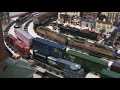 Here's a video of Lionel and MTH Electric Trains Union Pacific Heritage SD70ACe's in action around the Christmas Tree. The Union Pacific painted one locomotive in a special paint scheme for six of the railroads they bought over the years. There was a locomotive painted for the Missouri Pacific, Western Pacific, Missouri Kansas Texas, or often called the Katy, Rio Grande, Chicago and North Western, and the Southern Pacific. Both Lionel and MTH Electric Trains made models of each locomotive. Both companies, in my opinion, did an excellent job making these locomotives. Starting on the outside track are Katy and Missouri Pacific locomotives made by Lionel pulling a double stack train. The second track in has Southern Pacific and Chicago and North Western locomotives made by Lionel pulling a mixed freight. The third track has Rio Grande and Western Pacific locomotives made by MTH Electric Trains pulling a hopper train and on the inside track there is a Union Pacific locomotive made by MTH Electric Trains pulling a train of pulpwood and lumber cars. The rolling stock is made by Atlas O, Lionel, MTH, and Weaver Models. The trolley is made by Industrial Rail and has been serving this city since 2001. In this video you will see almost all of the village I set up under the Christmas Tree. What started with a gas station and school has grown into a small city over the years. The buildings are made by AmeriTown, City Seen, Department 56, K-Line, Lionel, MTH Electric Trains, Model <b>...</b>