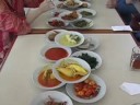 padang food is usually cooked once per day, and all customers choose from those dishes, which are left out on display until no food is left. it is served in small portions of various dishes, but constituting, with rice, a complete meal. in a padang-style restaurant, the table will quickly be set with dozens of small dishes filled with highly-flavored foods such as curried fish, fried tempeh, stewed greens, chili eggplant, curried beef liver, fried chicken, and of course, sambals, the spicy sauces ubiquitous at tables. customers take and pay for only what they eat. the best known padang dish is rendang, a spicy meat stew. soto padang (crispy beef in spicy soup)  sate (beef satay in curry sauce served with ketupat)