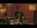 this was for my spanish project
i did everything guitar (shitty sorry), drums, and vocals lol

to record the drums i used my cad-pro 4 standard drum mics with a shure sm57 2 ft above my highest cymbal in the center and plugged it into my pa then via m-audio moblile preusb on one mono track in ableton live 6

for guitar i just used the shure sm57 about 4 inches away from the speaker of the amp and ran it into the m-audio mobile preusb and into ableton live 6

vocals i used a shure pg58 into one mono channel into the pa via m-audio mobile preusb and added reverb and natural tones  in ableton live 6

finally i mixed it all into one track and then recorded this video (im not playing the actual notes on guitar since i didnt know what i was doing before) i used cyberlink powerdirector to produce it

thats basically it, if you have any questions just ask.

translation:
hi my name is drew
i am good, and you?

i go to school everyday
i study but its boring
everyday everyday

chorus: 2x
nothing nothing lemonade
nothing nothing lemonade
nothing nothing lemonade
its what i do

i arrive at my house
my puppy is fun

i work on my home work
i dont like my home work

chorus 2x

i like to skate
i like to swim

i dont like to run
yes i like to eat

chorus 2x

i love the drums
i play them alot

i love music
i listen every day
i listen every day

chorus 4x

i love taco bell
