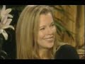 Kim Basinger laughs and feeds strawberries to Fierita