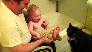 Cat Licking Baby Toes