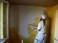 Plastering a wall ( thin layer )