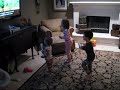 Kids and Toddler running to WII Fit