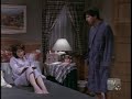 A scene from Everybody Loves Raymond with Patricia Heaton lying on her bed barefoot.