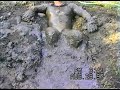 Tight lycra wetsuit in farm mudpit