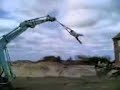Contruction daredevil on a crane. Swing