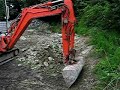 Schaeff HR14 Mini digger tidying up some stone pt1
