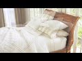 In case you want to give your bedroom a delicate and soothing look, white linen bedding style is probably the best choice. In this Pottery Barn video, bedding stylist, Steven Whitehead, demonstrates how to use, manage and maintain white bedding sets and give your house a peaceful and relaxing look. On an average, people spend almost one-third of their life in bed. This is a personal space where you can relax and rejuvenate, and so the bedding style and its texture play an important role. White linen fabric looks very delicate and classy in a bedroom. The exciting range offered by Pottery Barn can be machine-washed and is easy to manage. The great thing about white bedding is that it is very easy to update and you can always mix and match different colors to get a new look every time. It is a timeless color that adds grace to your home décor. The best part is that you can add as many pillows and other accessories with your white bedding and it will blend in perfectly. You can also create many personas with white bedding set including a masculine and organized look, a feminine and delicate look and a romantic and soothing impression. Along with this, you can decorate your space according to seasons. Light sheets with cotton blankets in summers and cozy blankets with luxury bed spread in winters will make your bed simply outstanding. The classic range of Pottery Barn white linen beddings can be used in every season. Steven takes care of white bedding sets by carefully <b>...</b>