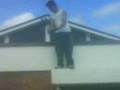 Al Climbing Down A Roof