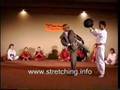 Tom Kurz throws high roundhouse kicks without any warm-up
