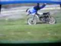 Fat ladie whips out on a dirt bike