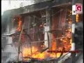Firefighters attempt to put out a raging fire at a shop in Kottawa today