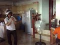 Arco wears a helmet while Playing WII