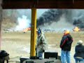 Guy shooting  50 CAL from the hip