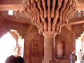 A view inside the Diwan-i-Khas in Fatehpur Sikri with closeup of the stone carving. Fatehpur Sikri is an abandoned city near Agra in India. - Diwan-i-Khas in Fatehpur Sikri