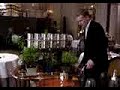 a waiter snipping fresh herbs for tea at famous alain ducasse restaurant paris.