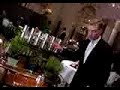 a waiter snipping fresh herbs for tea at famous alain ducasse restaurant paris.