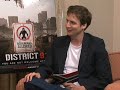 For more Surf highlights and celebrity interviews visit: www.bite.ca The Surfs international correspondent interviews District 9 director Neill Blomkamp and star Sharlto Copley. Watch as he cuts right to the chase with some hard hitting questions about the ill-fated Halo film.