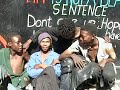 during a theatre production in south africa, geert mul had handed out ten digital video cameras to street-kids of hillbrow, johannesburg. he asked them to portray their friends and their surroundings. out of the 14 hours of dramatic video material that returned, mul selected a few seconds to create the video portraits 'look at us' and dreamboy
 
'look at us' is an invitation to look straight into the eyes of street kids at downtown johannesburg.  
but it also challenges us to 'look at ourselves' trough the eyes of those same kids, who appear to be staring at us in return.
 
