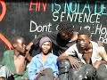 during a theatre production in south africa, geert mul had handed out ten digital video cameras to street-kids of hillbrow, johannesburg. he asked them to portray their friends and their surroundings. out of the 14 hours of dramatic video material that returned, mul selected a few seconds to create the video portraits 'look at us' and dreamboy
 
'look at us' is an invitation to look straight into the eyes of street kids at downtown johannesburg.  
but it also challenges us to 'look at ourselves' trough the eyes of those same kids, who appear to be staring at us in return.
 
