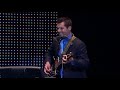 Rich Hardesty sings live while playing guitar/harmonica riding a unicycle on a treadmill at the convention center in Anaheim California in front of 4500 folks at the Limitless contest for Lifevantage and wins contest.