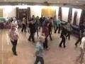 Clip of line dancers to madonna give it 2 me