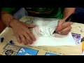 Dan Paladin of The Behemoth drawing characters for me at SDCC 2011