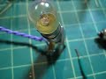 here i use a reed relay to switch control of two circuits. a reed relay is uses a thin magnetic strip, hence 'reed' as the inductive medium. this was to test it out in a circuit before using ac power