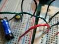 here i use a reed relay to switch control of two circuits. a reed relay is uses a thin magnetic strip, hence 'reed' as the inductive medium. this was to test it out in a circuit before using ac power