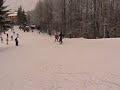 Nia is skiing with a teacher