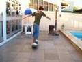 longboard skater in a backyard
