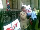 adam walker and richard barnbrook speaking at the protest outside the gtc building after judy moorhouse stood down