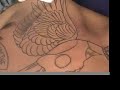 Skull and wings full chest tattoo