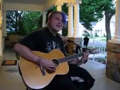 proudhon in manhattan - Dustin singing and playing his guitar for me on the front porch.