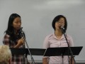 dinny aletheiani (left) and dora sutanto (right) singing a cappella 