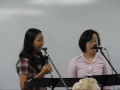dinny aletheiani (left) and dora sutanto (right) singing a cappella 